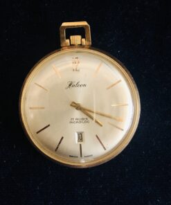 Reloj de bolsillo marca Halcon, con fecha, 17 rubíes en el movimiento, en oro amarillo de ley 18 kts.