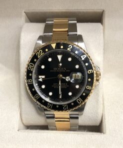 Rolex GMT-Master II, Oyster Perpetual Date, Ref.: 16713, automático, con esfera y bisel negros, automático, en acero y oro de ley 18 kts. Año 1990