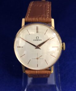 Reloj Omega Vintage con correa de piel genuina color marrón, en oro de ley 18 kts.
