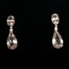 Pendientes largos con cuarzos rosas en talla oval y talla pera enriquecidos con 0'15 cts de brillantes en total, en oro amarillo de ley 18 kts.