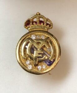 Pin para ojal, conmemorativo del Real Madrid, con brillantes, rubíes y zafiros en oro de ley 18 kts.