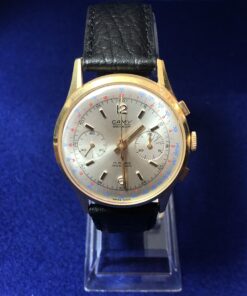 Reloj CAMY vintage con doble cronógrafo y taquímetro, con mecanismo de cuerda, realizado en oro amarillo de ley 18 kts.