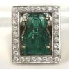 Gran sortija ancha con imagen de la Virgen tallada sobre esmeralda colombiana de 17 cts (aprox.) y enriquecida con 1'54 cts de brillantes, realizada en oro blanco y amarillo de ley 18 kts.