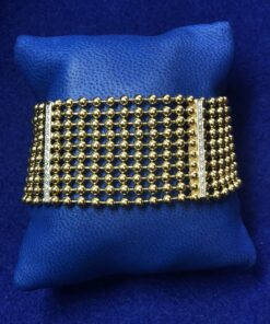 Precioso brazalete vintage (años 80) realizado con cuentas de oro de ley 18 kts y 4 filas de brillantes de 0'56 cts en total.